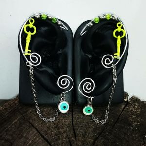 Wirewrap earcuffs. Uv light reacrive